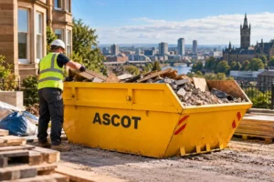 Worker loading construction waste into a yellow ASCOT skip in Glasgow.